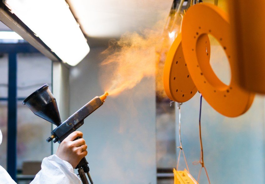 a worker powder coating 
