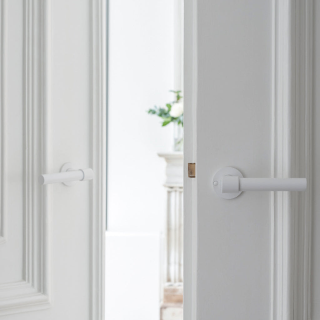 Formani ONE by Piet Boon door lever installed on a white interior door